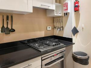 a kitchen with a stove top oven in a kitchen at Moat House 6 - Ukc4889 in Fort Augustus +9 photos