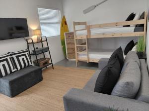 a living room with a couch and a bunk bed at My Plett, Your Plett in Plettenberg Bay +27 photos