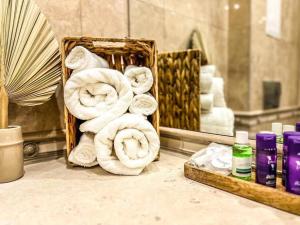 a pile of towels on a counter in a bathroom at Seaside Sunset - free parking in Golden Sands +22 photos