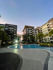 a swimming pool in the middle of a building at Atria Condo in Iloilo City