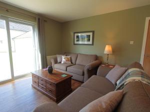 a living room with two couches and a coffee table at Cottage 7 - Skye Cottage - Ukc4884 in Fort Augustus