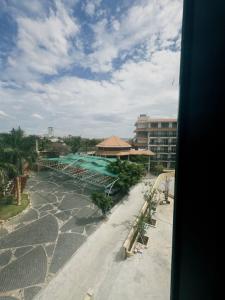 a view of a resort with a pool and a building at Mui Da Hotel in Phan Thiet +53 photos