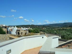 Belvilla by OYO Holiday home in Algheroにあるバルコニーまたはテラス