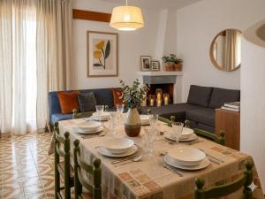 a living room with a table and a couch at VILLETTA 8 - Premium Villas in Giulianova