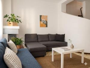 a living room with a couch and a table at VILLETTA 8 - Premium Villas in Giulianova