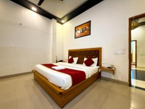 a bedroom with a large bed in a room at AARYA Corbett Resort & SPA - 8 minutes drive to Kosi River in Nainital