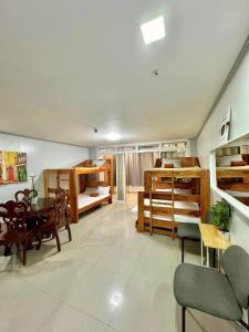 a living room with bunk beds and a dining room at Your Quiet Home with Unbeatable location in Baguio