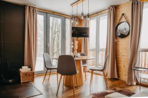 a dining room with a table and chairs at Tiny house v Moravském Berouně in Moravský Beroun