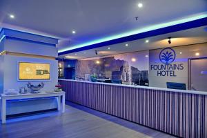a fast food restaurant with a counter in front of it at Fountains Hotel by Neighbourgood in Cape Town +36 photos