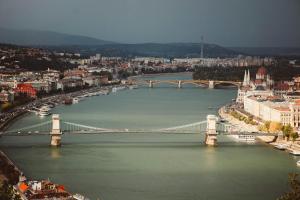 a view of a bridge over a river with a city at Hotel Orion in Budapest +81 photos