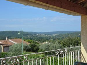 a view from the balcony of a house at Villa with swimming pool and valley view in Cornillon