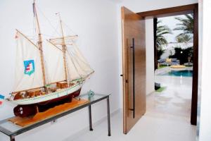 a model of a boat on a table in a room at Villa el Kasbah in Midoun