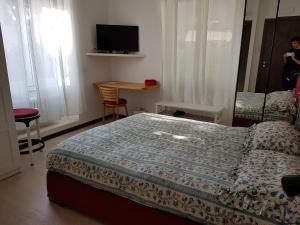 Postel nebo postele na pokoji v ubytování B&B Rosa Blu