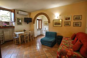 a living room with a couch and a table at La Torre Nomipesciolini in San Gimignano