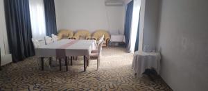 a dining room with a table and chairs at Hotel Dana 2 in Satu Mare