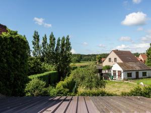a view from the roof of a house at In a quiet location nearby the woods in Ruiselede