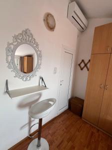 a bathroom with a sink and a mirror on the wall at Apartments Teodora Obala in Petrovac na Moru +78 photos