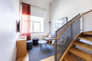 a room with stairs and a table and a chair at Mercure Gothenburg in Gothenburg