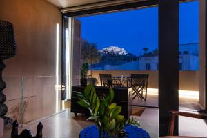 a living room with a view of a house at Architects Masterpiece Villa with Private Rooftop in Athens +71 photos