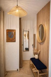 a living room with a table and a mirror at Le Paradis' c'est ici in Gréoux-les-Bains +22 photos
