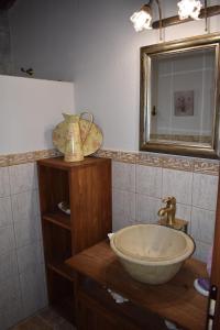 a bathroom with a sink and a mirror at Villa Arvi in Arvi +12 photos