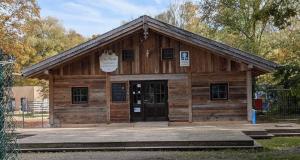 a small wooden building with a door in front at Munich Oktoberfest on a Budget including breakfast in Munich