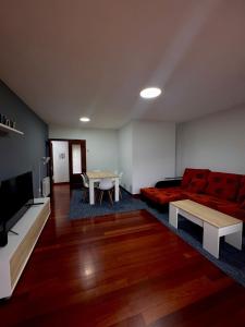 a living room with a couch and a table at Fuerte El Mazo in El Dueso