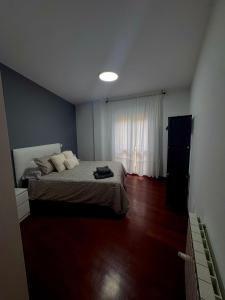 a bedroom with a bed and a window at Fuerte El Mazo in El Dueso