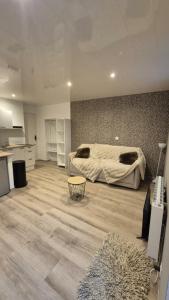 a large bedroom with a bed and a kitchen at Studio Margny in Margny +10 photos
