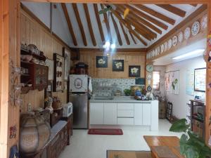 a kitchen with a refrigerator and a stove at Shine Wolyeong in Andong +23 photos