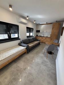 a living room with a couch and a table at Nocleg Szwed-Pol in Jastrowie