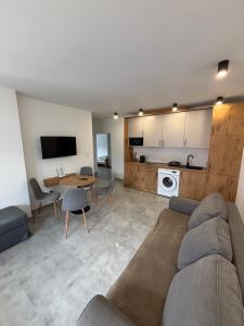 a living room with a couch and a table at Nocleg Szwed-Pol in Jastrowie +36 photos