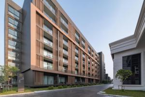 an external view of a building at Mandarin Eastville, Pattaya - SHA Extra Plus in North Pattaya
