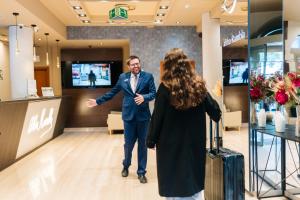 a man and a woman standing in a store at Abba Rambla Hotel in Barcelona