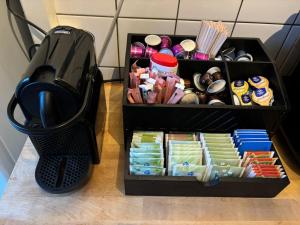 a black container filled with food next to a trash can at Nijmegen Cozy Guest Rooms in Nijmegen