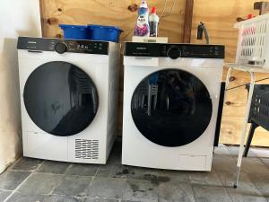 two white washing machines sitting next to each other at Authentic Farmhouse, near beach in Kloosterzande