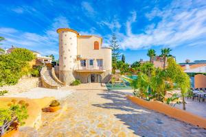 a large building with a tower on top of it at Villa Cronos - PlusHolidays in Ifach