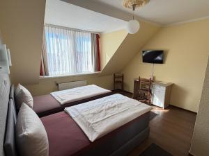 Llit o llits en una habitació de Hotel Sieme 8 fotos més