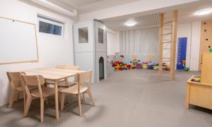 a dining room with a table and chairs at Hotel Kirchboden by Alpeffect Hotels in Wagrain