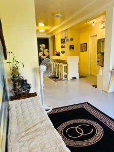 a living room with a floor fan and a rug at Daltans Home Stay Siargao in General Luna