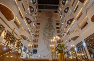 a lobby of a building with a chandelier at Iconic Plaza Hotel in Nairobi