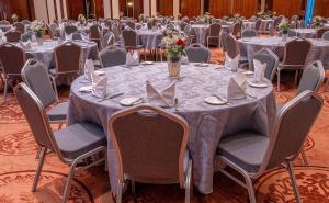 a group of tables and chairs in a banquet hall at Iconic Plaza Hotel in Nairobi