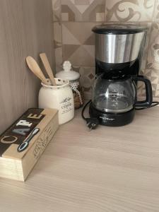 a counter with a blender and a box on it at Casa Mina in Lavagna