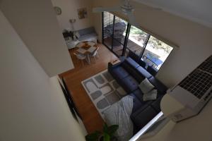 an overhead view of a living room with a laptop at Sea Renity Preston Beach in Preston Beach