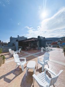 a group of chairs and tables on a roof at Edificio PRISMA I in Villa Carlos Paz