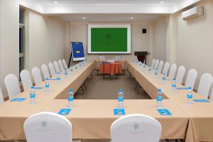 a conference room with tables and chairs with water bottles at Juba Landmark Hotel in Juba +41 photos