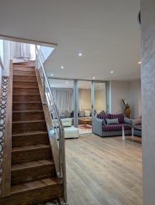 a staircase in a house with a living room at Tanger City 5 in Tangier