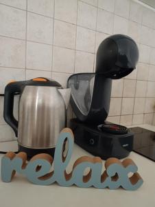 a coffee maker sitting on top of a counter at Moskva Apartman in Brčko
