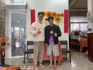 a man and a boy posing for a picture at Kavy Homestay in Thôn Trường Giang