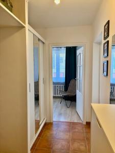a hallway with a door leading to a living room at Przy Zamenhofa in Nowa Sól